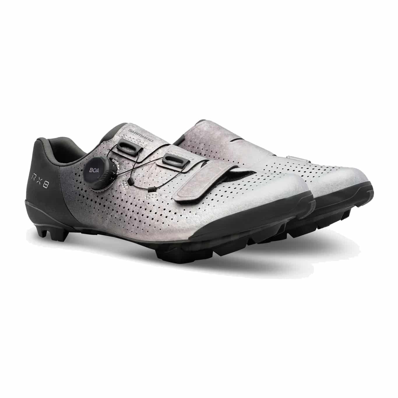Pair of Shimano SH-RX801 gravel shoes in silver, three-quarter view