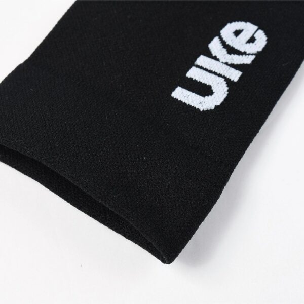 Close-up of the UKE logo on the black LingJun sock cuff