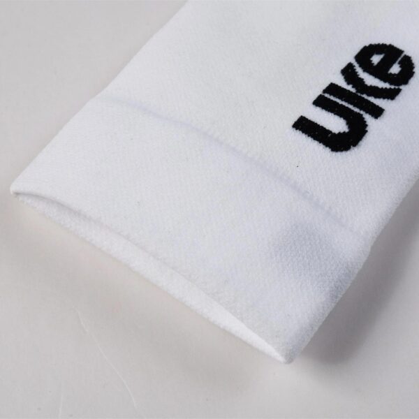 Close-up of the UKE logo on the white LingJun sock cuff