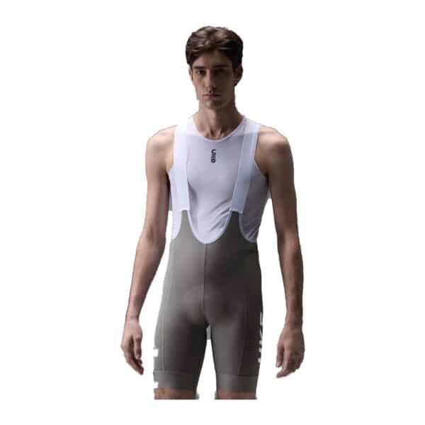 UKE RP400 men's bib shorts in the Pale Azalea colourway, worn by a model, front view