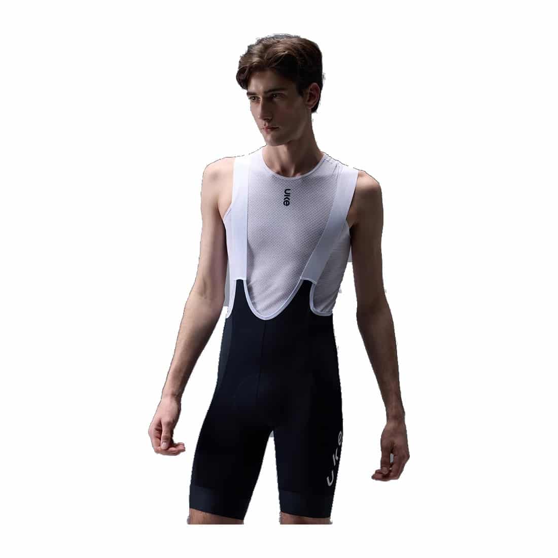 UKE RPC400 men's cargo bib shorts in black with white mesh upper, worn by a model, front view