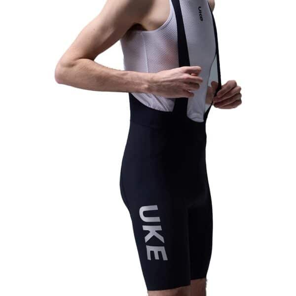 UKE RS200 bib shorts in Black, side view with UKE leg print