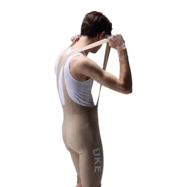 UKE RS200 bib shorts in Grayish Brown, three-quarter back view