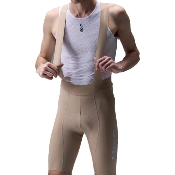 UKE RS200 bib shorts in Grayish Brown, front close-up of the pad area and straps